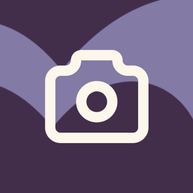 Ikon af kamera på lilla baggrund